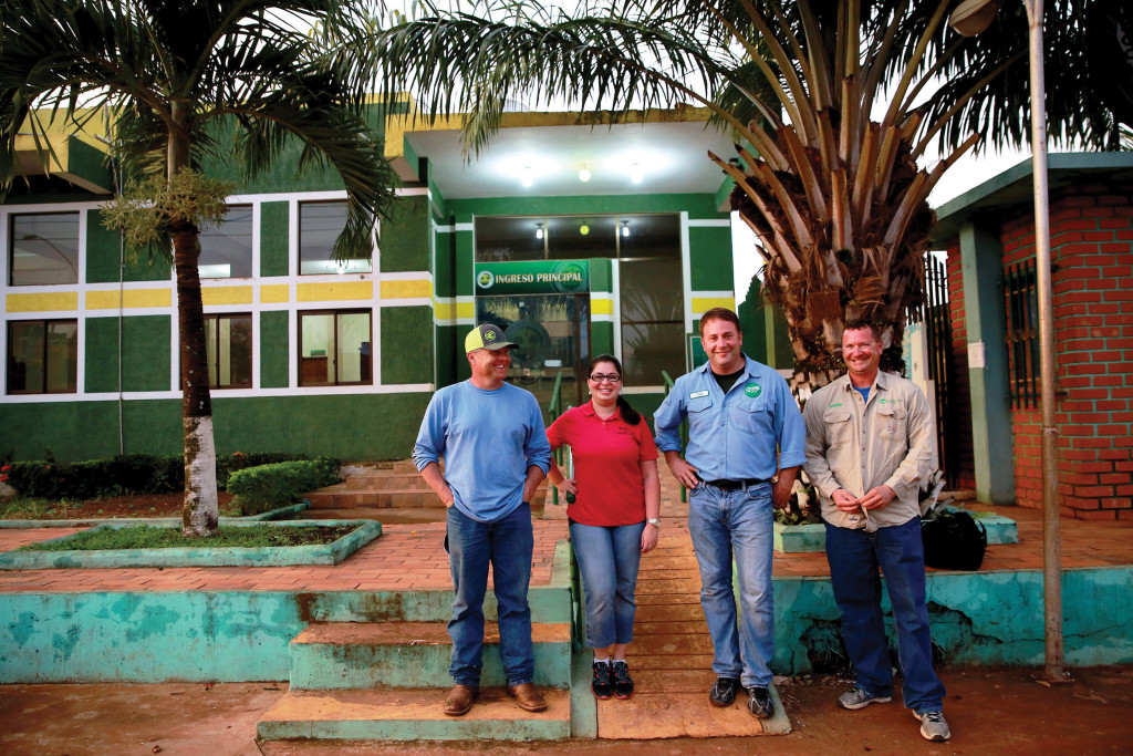 (from left) Wade Hurst and Anna Politano from Oklahoma and Craig Moeller and Roger Berhorst from Missouri pose outside the Cooperative Electrica Riberalta offices in Riberalta, Bolivia. (Photo by Noah Friedman-Rudovsky)
