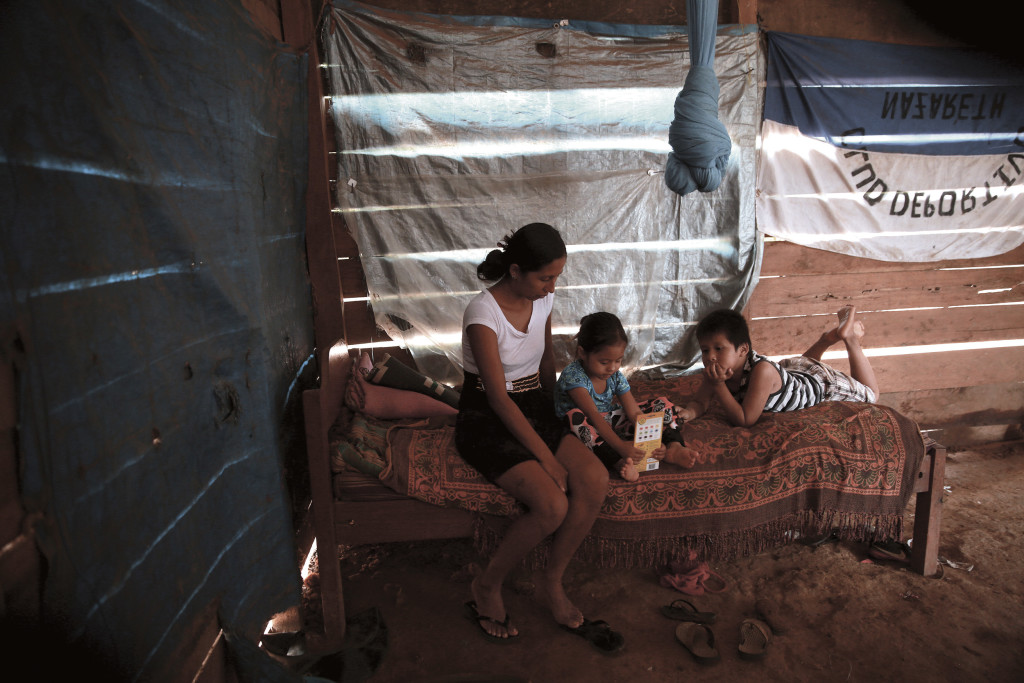 Isabel and her children, Luz and Angel, Make do in a small home with no power in Dos de Junio, northern Bolivia. (Photo by Noah Friedman- Rudovsky)