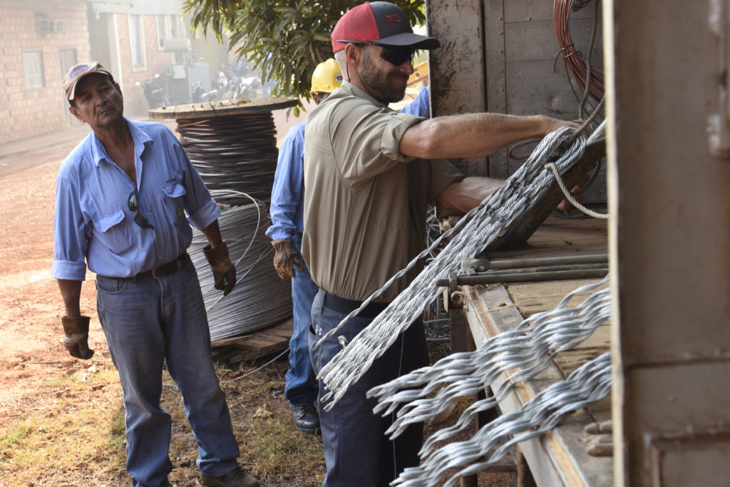 Damon Lester helps load a truck full of supplies and tools in the village of Dos de Junio, Bolivia. (Photo by Jim McCarty)