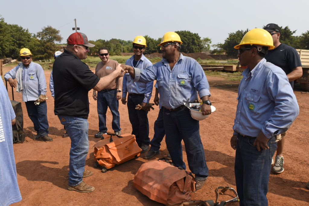 Stacy Bourne delivers tools to linemen in Bolivia. (Photo by Jim McCarty)