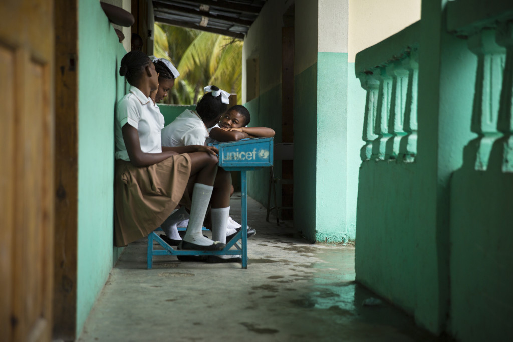 These youngsters braved the rain to go to school in Haiti, unlike many of their classmates and teachers. (Photo By: Garrett Hubbard) 